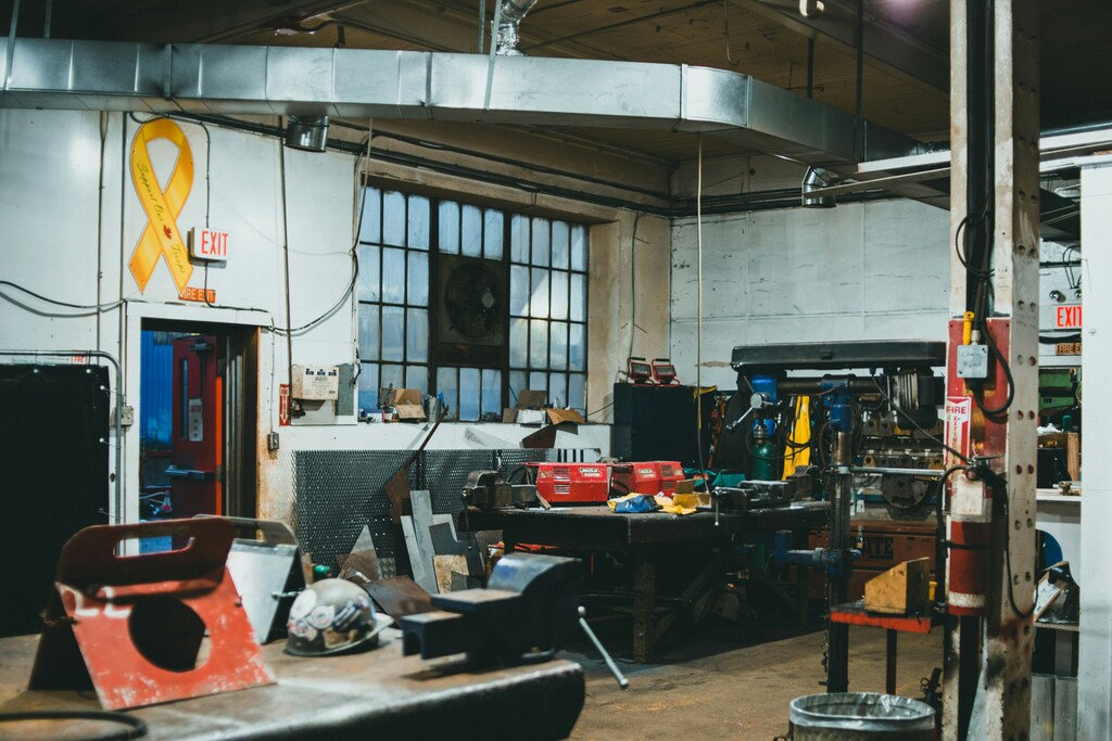 Custom manufacturing workshop showing various projects at different stages of completion